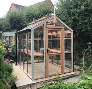 Glass to ground greenhouse