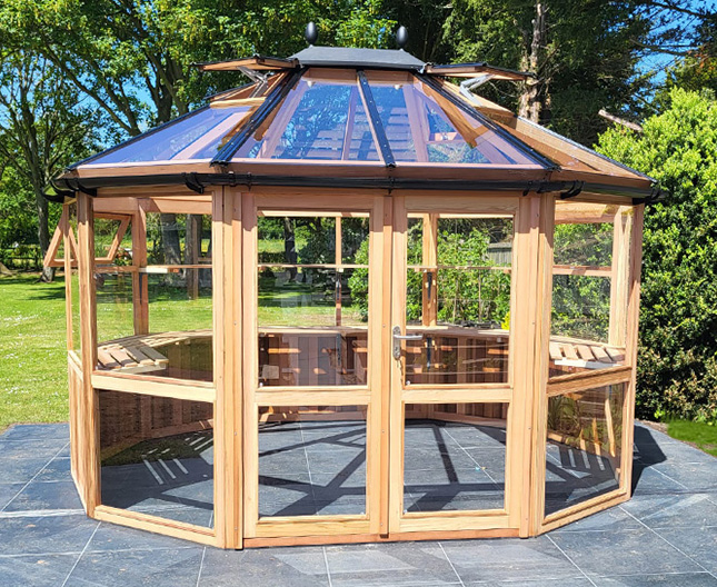 large round Cedar Greenhouse 12ft x 10ft wooden greenhouse for garden focal point