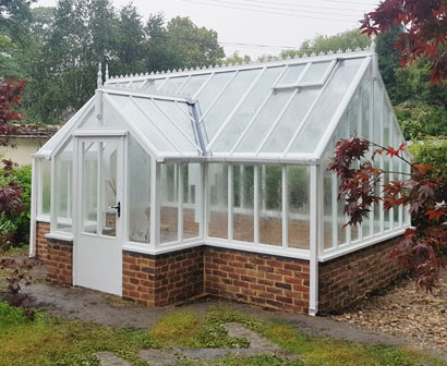Painted White wooden greenhouse